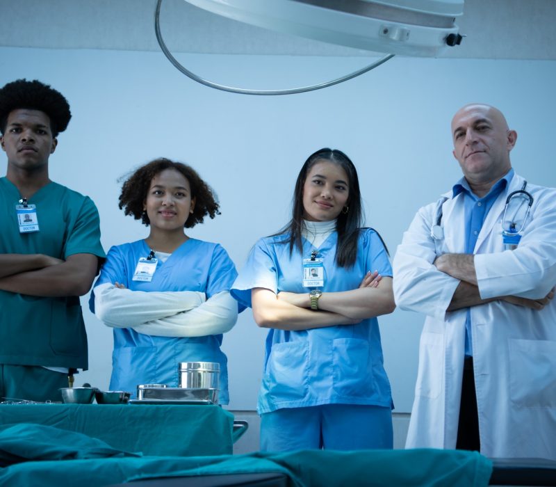 Medical professors and medical students team prepare before teaching surgery to medical students